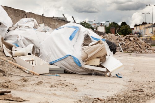 Truck from waste removal service collecting commercial waste