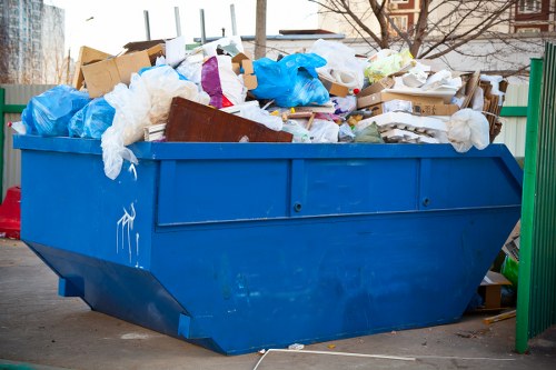 Residents arranging furniture for disposal in Southkensington